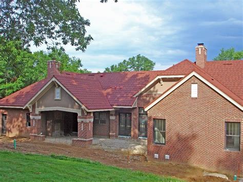 green metal roof on red brick house|red brick house roof colours.